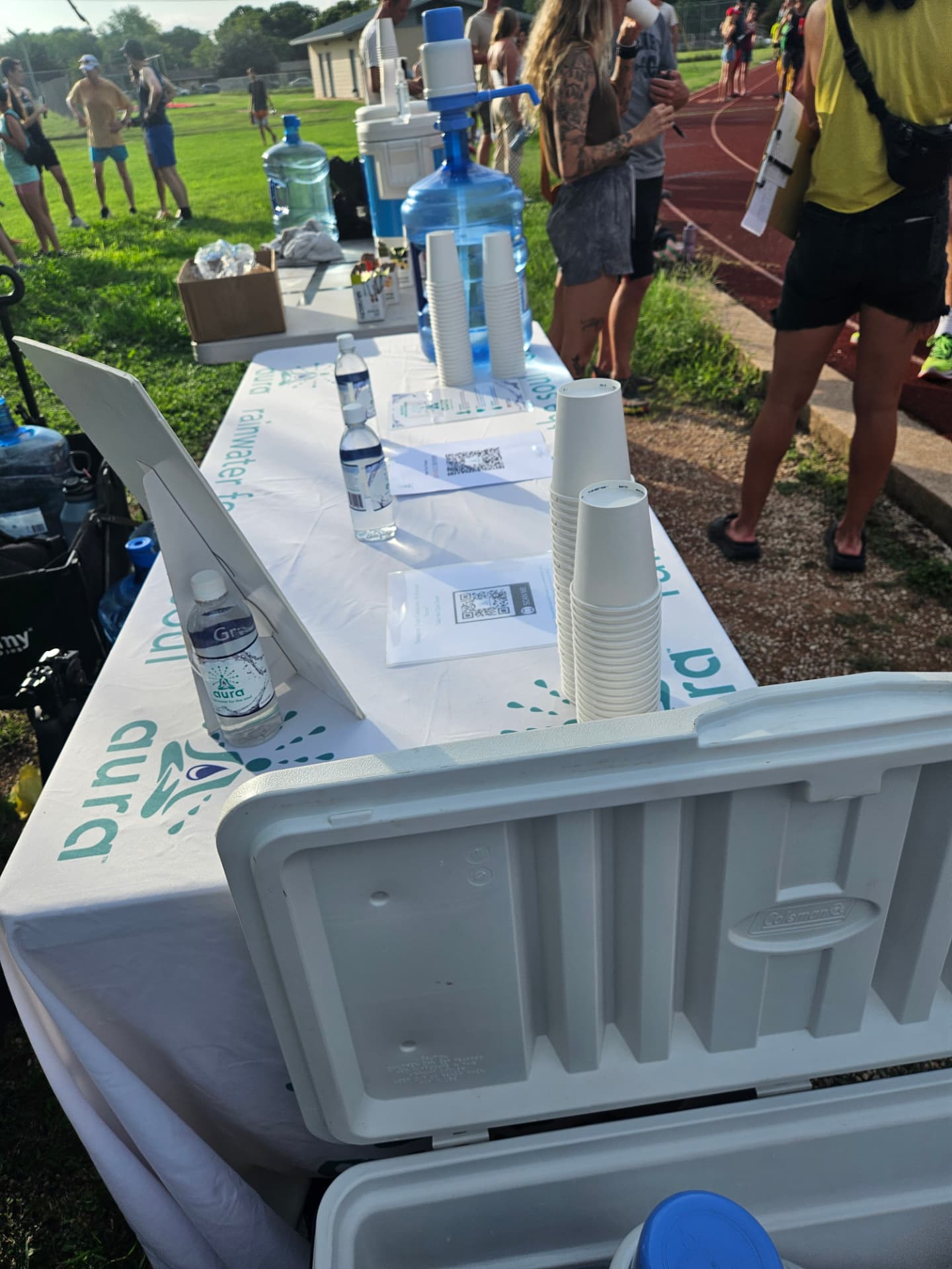 Aura Rainwater community hydration station at an outdoor community event.